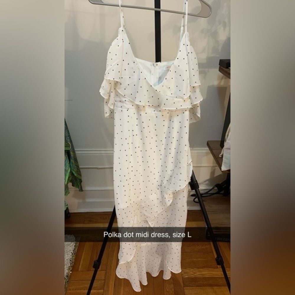 Polka dot midi dress with high low hem and exposed shoulders